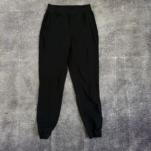 Women's Lululemon Black Surge Jogger Windbreaker Stretch Ankle Zip Up Pants Sz 4